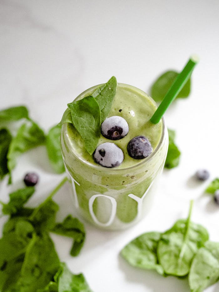 The Art of Drawing Readers In: Your attractive post title goes here Invigorating green smoothie with spinach and blueberries, perfect for a healthy boost.